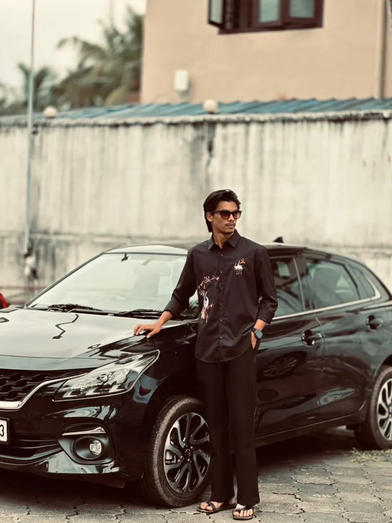 top-seo-specialist-in-sharjah standing front of his car